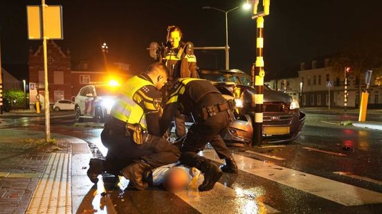 Bestuurder rijdt tegen verkeerslicht, bedreigt omstander en verzet zich tegen politie